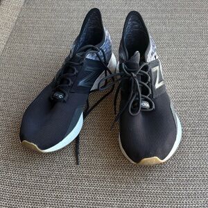 Excellent condition, New Balance Black Sneakers with Gold Highlights